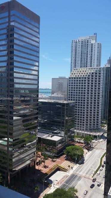 An elevated view of a city street lined with tall glass and concrete office buildings — 500 Brickell Ave # 2604, Miami FL 33131, MIAMI, FL