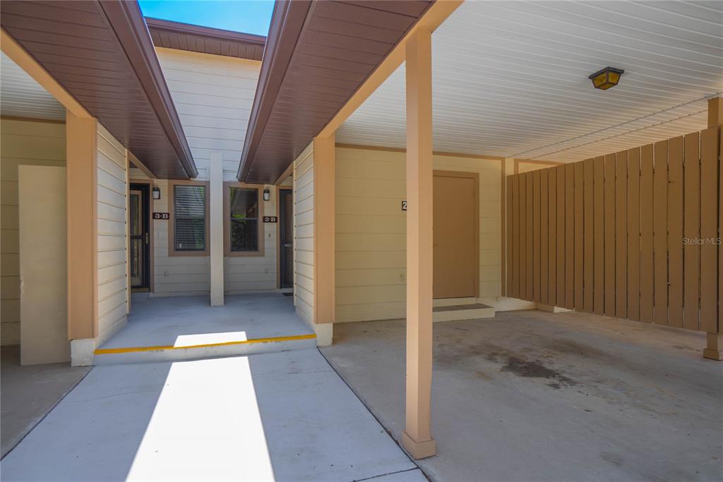 A covered carport area features a concrete floor and two unit entrances labeled 3-B and 2-B — 270 E GLASSBORO COURT UNIT 2B, HERNANDO, FL