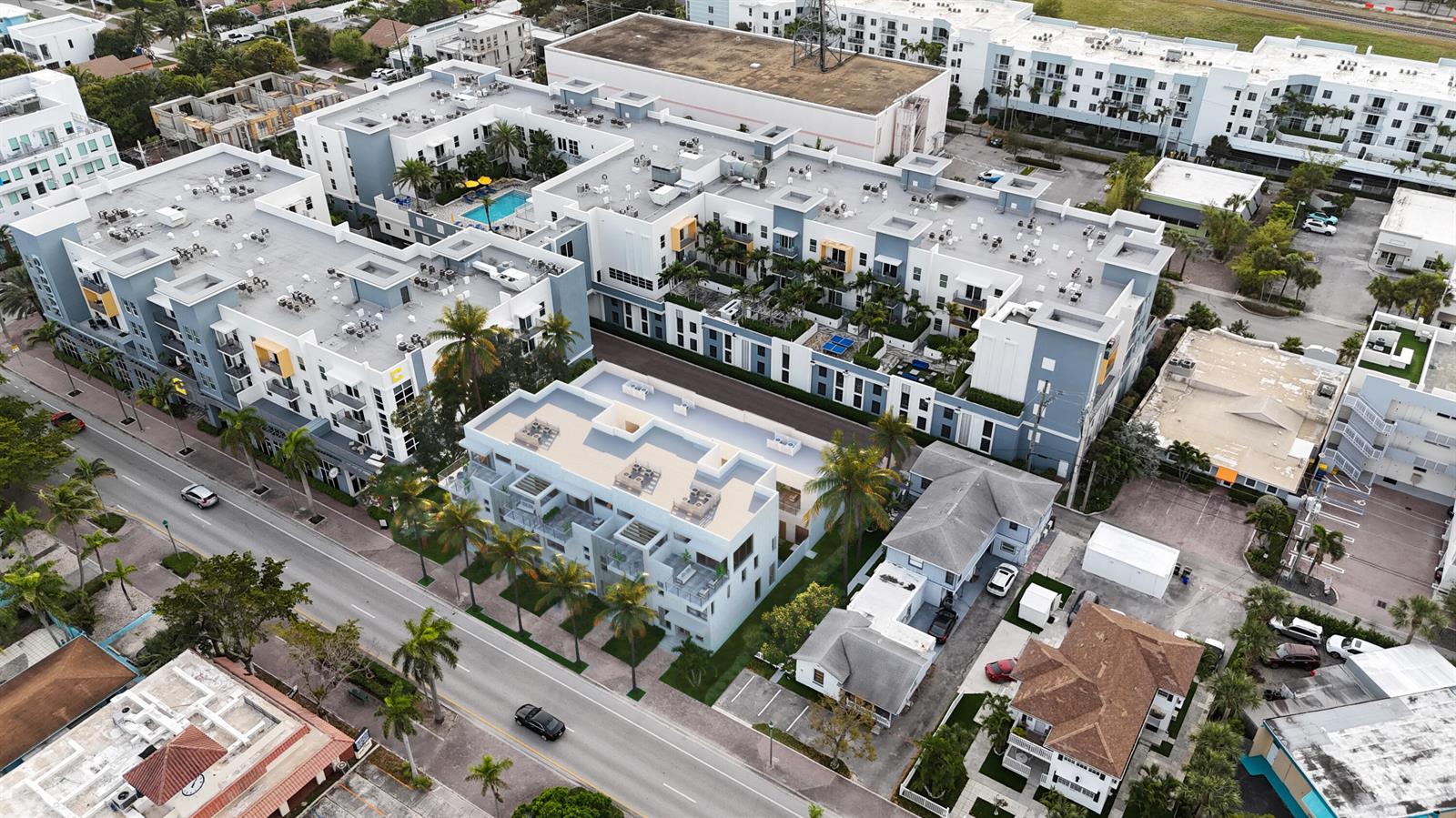 An aerial view shows a multi-story apartment complex with a pool and surrounding residential buildings — 146 SE 5th Avenue # 3, Delray Beach FL 33483, DELRAY BEACH, FL