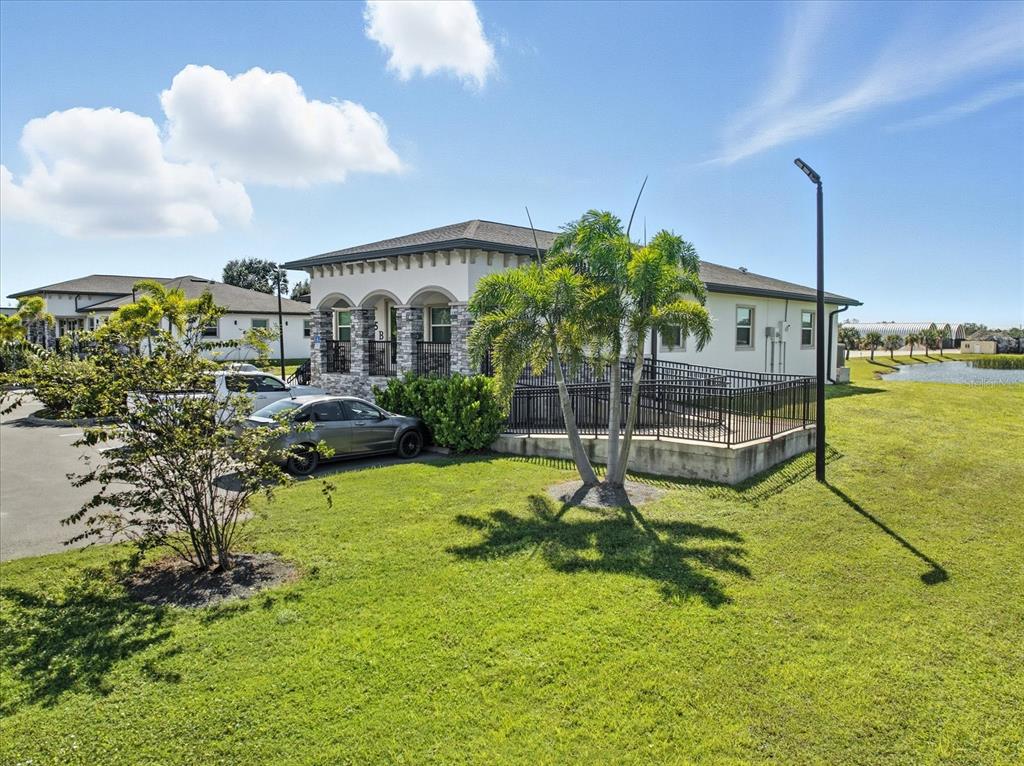 A single-story building with a stone facade, arched entryway, and a wheelchair-accessible ramp — 10305 US HIGHWAY 41 N, PALMETTO, FL
