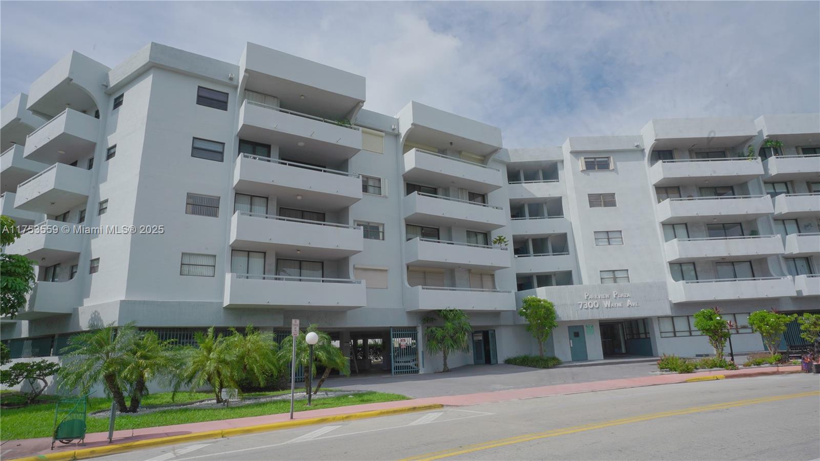 A multi-story apartment building with balconies and a ground-level parking area — 7300 Wayne Ave # 317, Miami Beach FL 33141, MIAMI BEACH, FL
