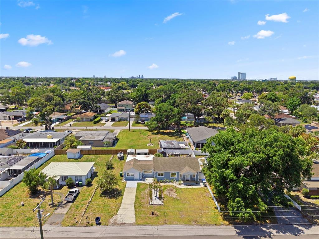 An aerial view shows a single-story house with a large yard and mature trees — 3144 W CORDELIA STREET, TAMPA, FL
