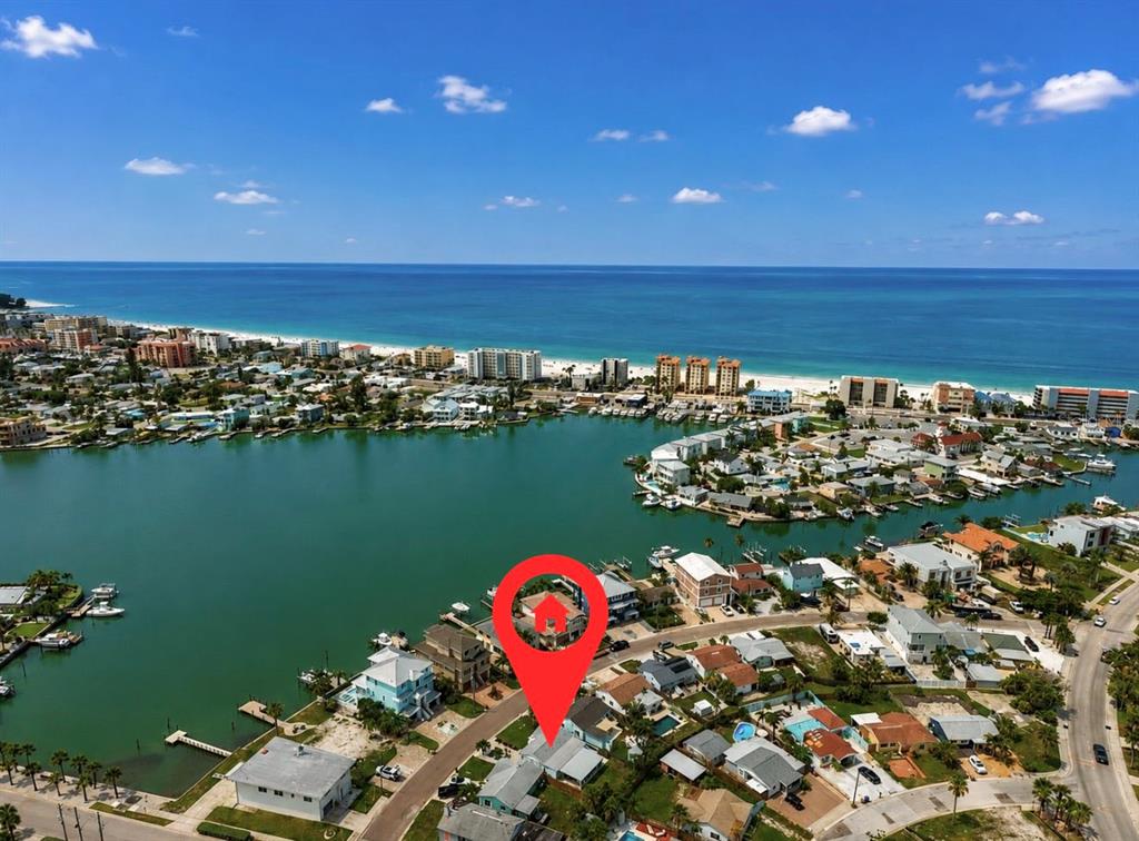 An aerial view shows a waterfront residential neighborhood with a red location pin on a house — 480 S BAYSHORE DRIVE, MADEIRA BEACH, FL