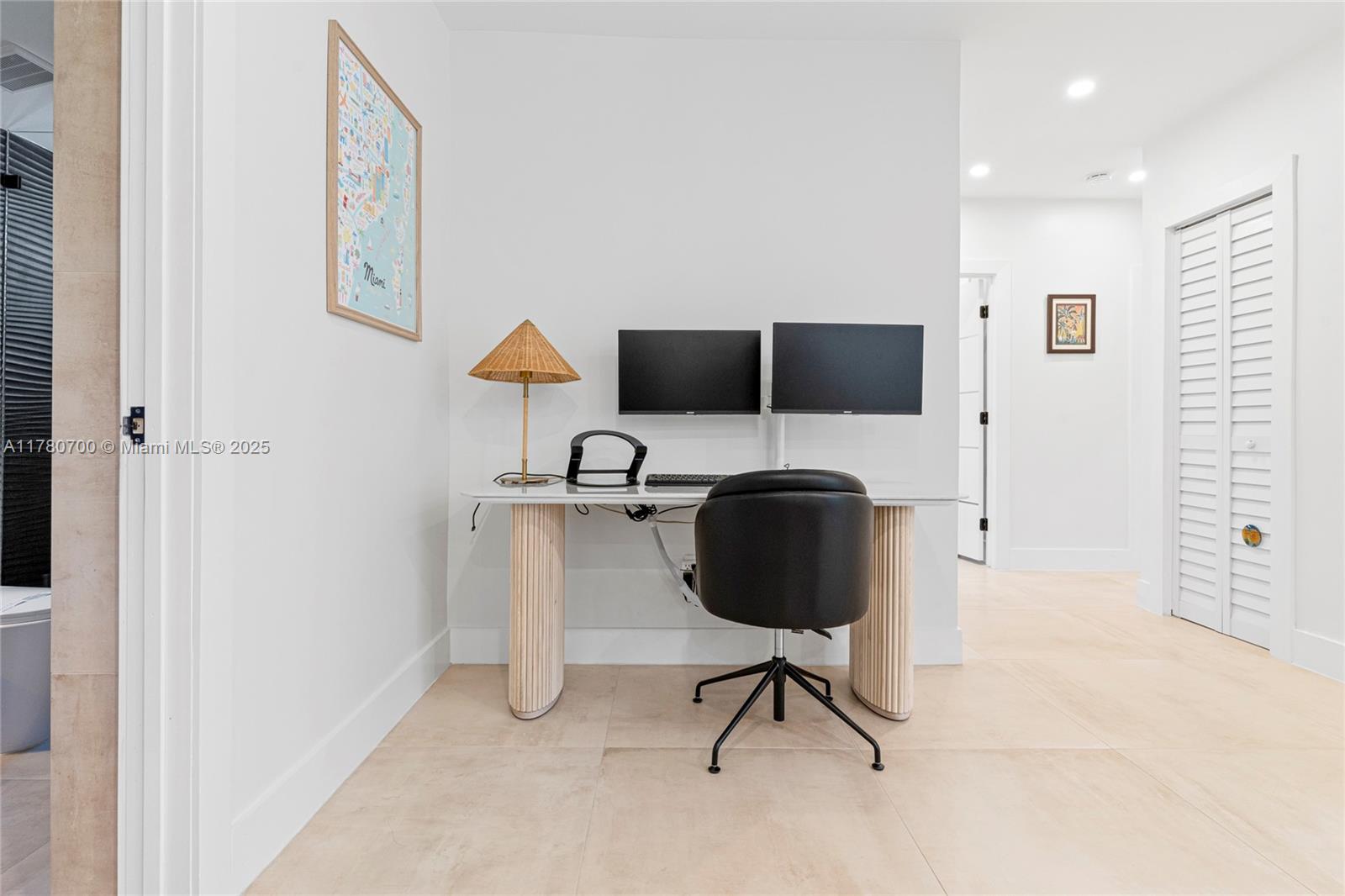 A home office area features a white desk with fluted legs and two computer monitors — 281 NE 48th Ter, Miami FL 33137, MIAMI, FL