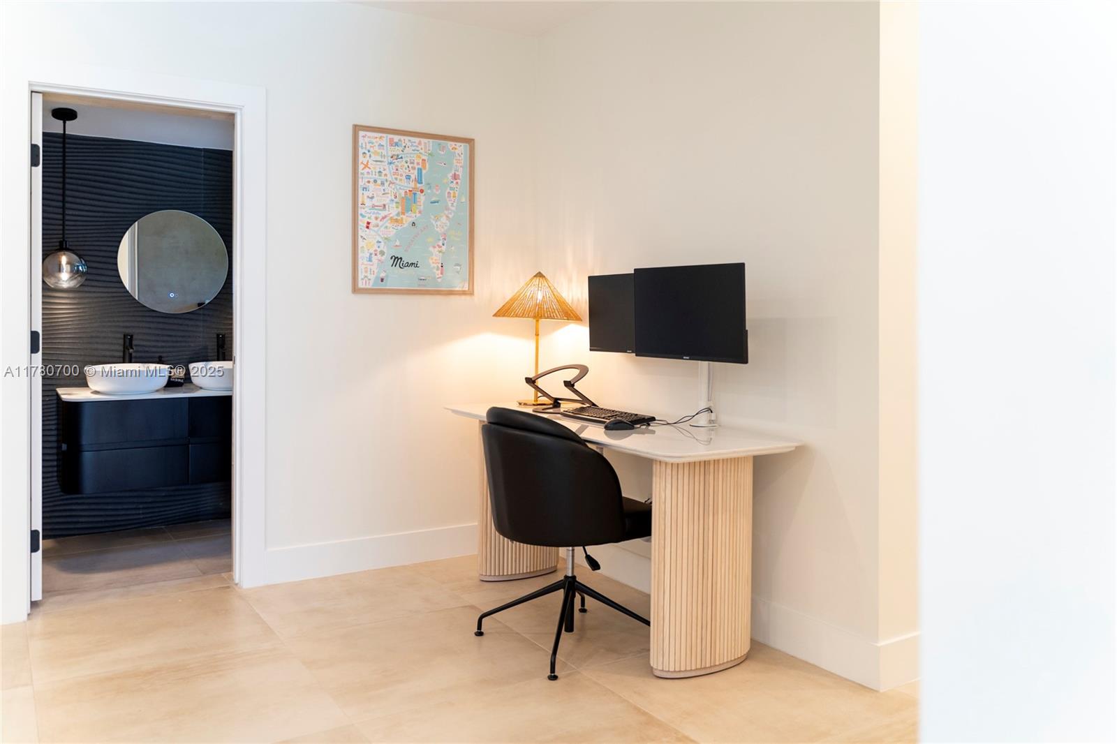 A home office area features a desk, chair, and computer monitors next to a bathroom — 281 NE 48th Ter, Miami FL 33137, MIAMI, FL