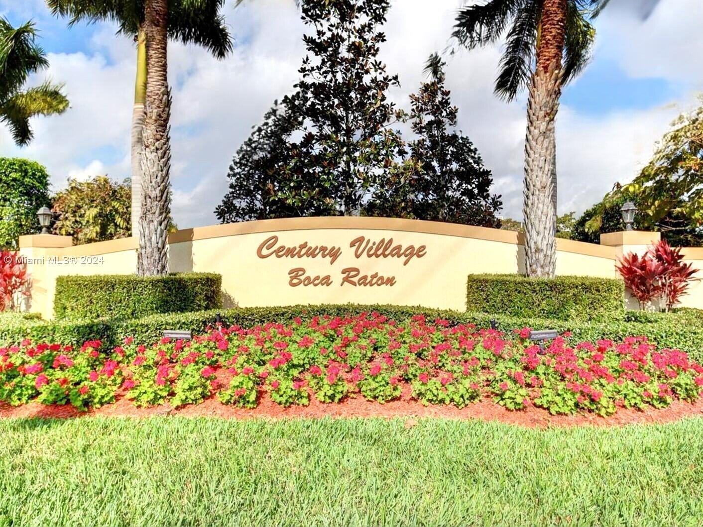 The entrance sign for Century Village in Boca Raton features landscaping and palm trees — 99 Mansfield C # 99, Boca Raton FL 33434, BOCA RATON, FL