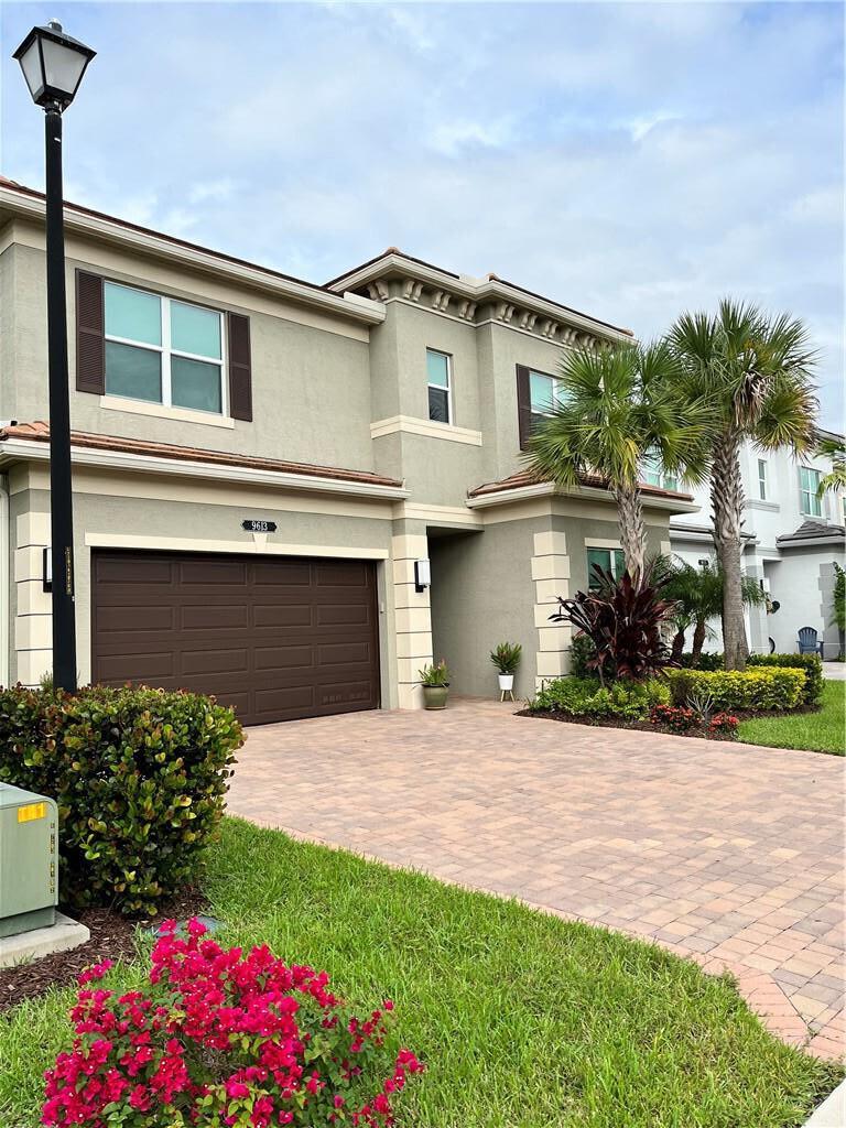 A two-story suburban house with a brown garage door and a paved driveway — 9613 Highland Pointe Pass, Delray Beach FL 33446, DELRAY BEACH, FL
