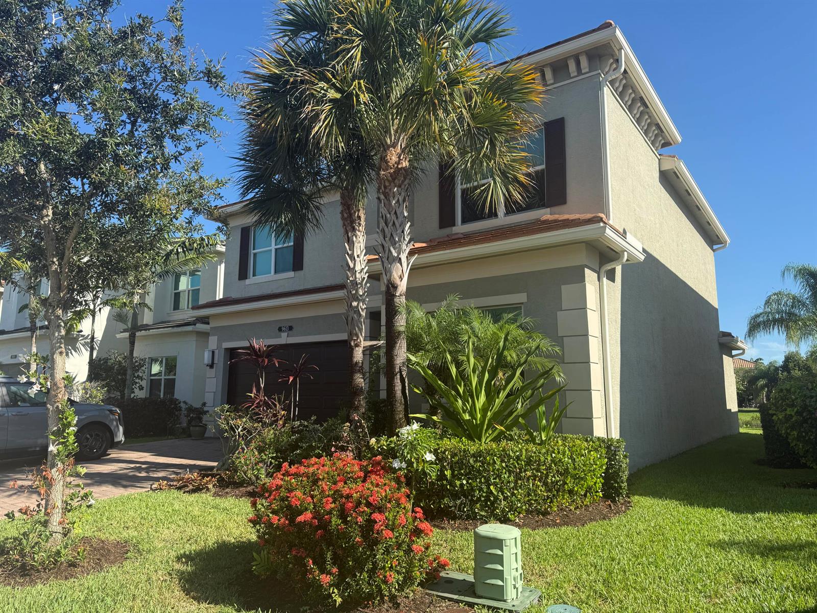 A two-story suburban house with a palm tree, landscaping, and a driveway in front — 9613 Highland Pointe Pass, Delray Beach FL 33446, DELRAY BEACH, FL