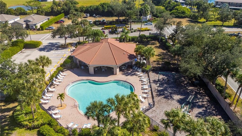 An aerial view shows a community pool, a covered pavilion, and a playground — 24311 RIVERFRONT DRIVE, PUNTA GORDA, FL