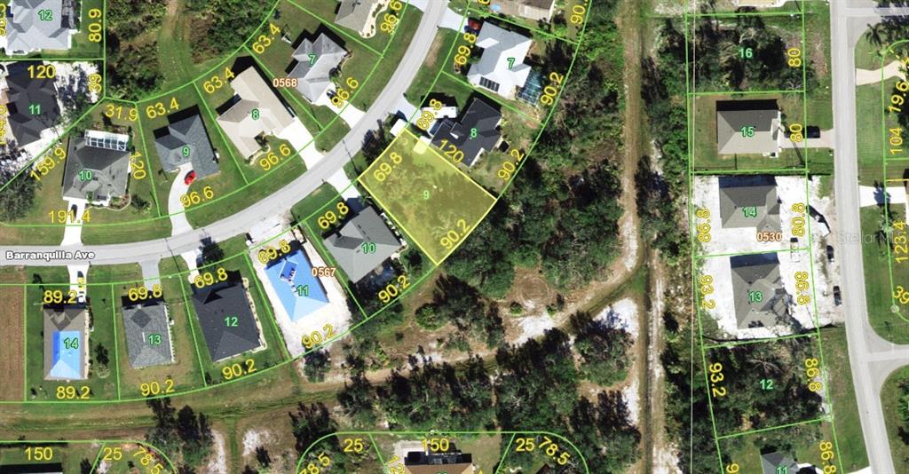 This is an aerial map showing residential lots and houses in a suburban neighborhood — 26517 BARRANQUILLA AVENUE, PUNTA GORDA, FL