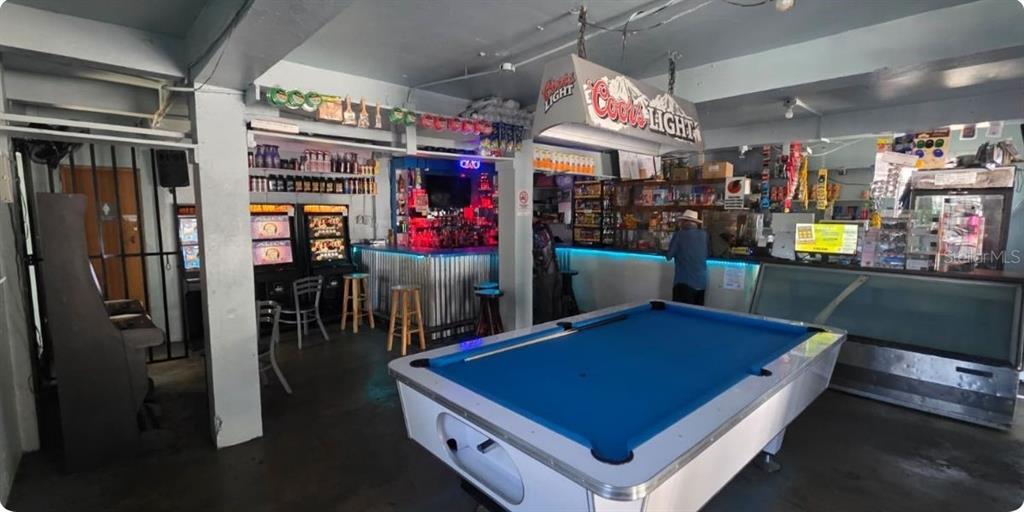 A bar area features a blue pool table, gaming machines, a counter, and stools — Carr PR-123 Km 78.9 BO HATO VIEJO, ARECIBO, PR