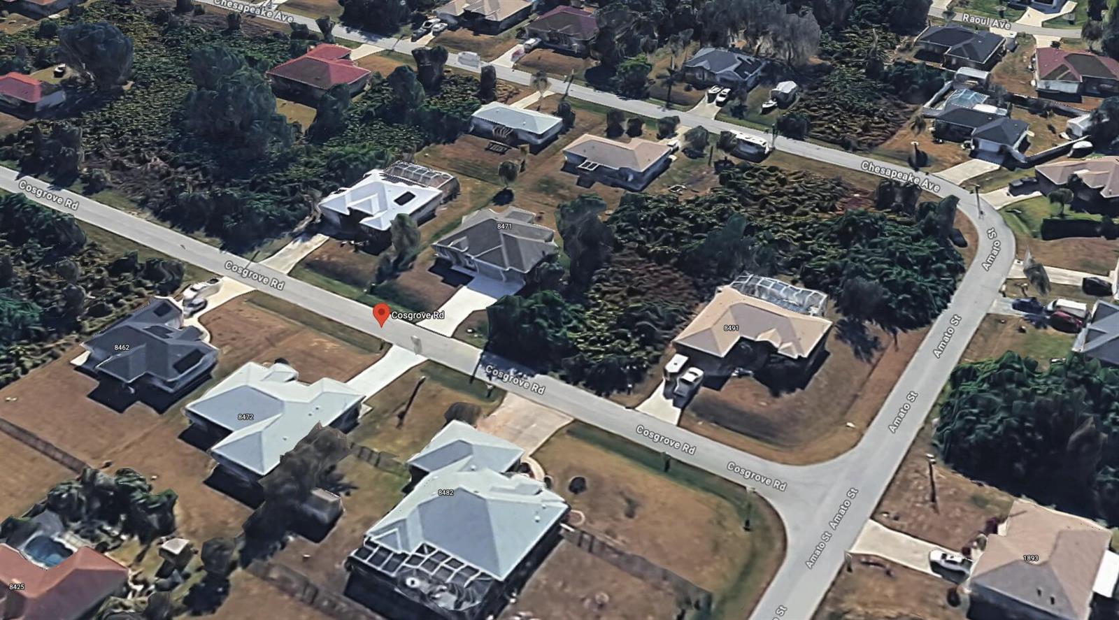 This aerial view shows a suburban neighborhood with several single-family homes and paved streets — Tbd Cosgrove Road, Venice FL 34291, VENICE, FL