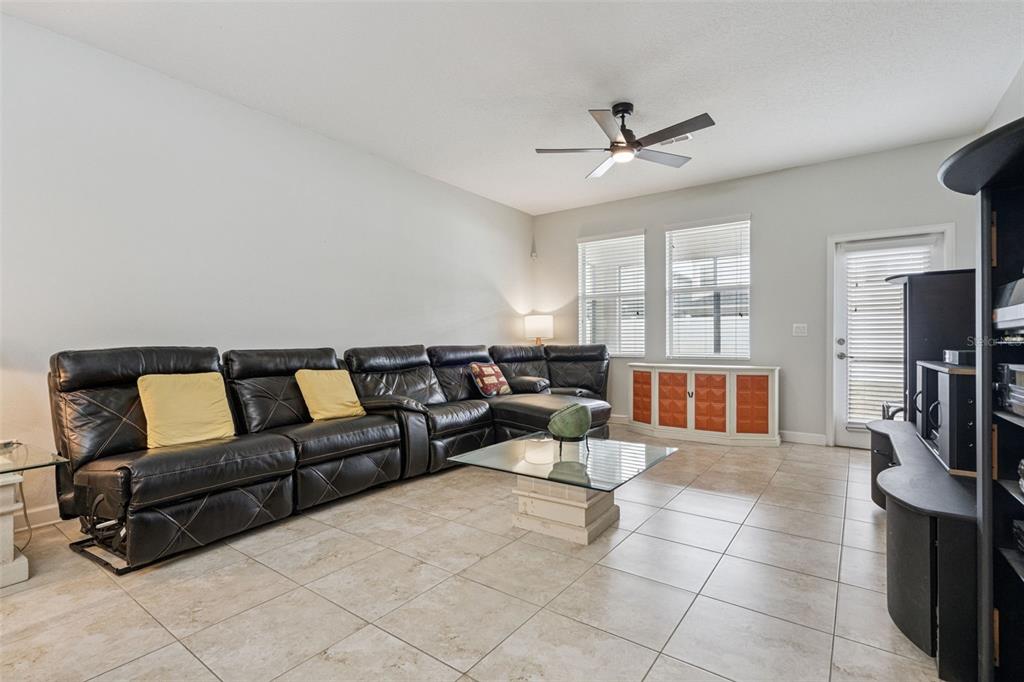 An entryway features tile flooring, a white front door with a transom window, and stairs — 4633 FAIRY TALE CIRCLE, KISSIMMEE, FL
