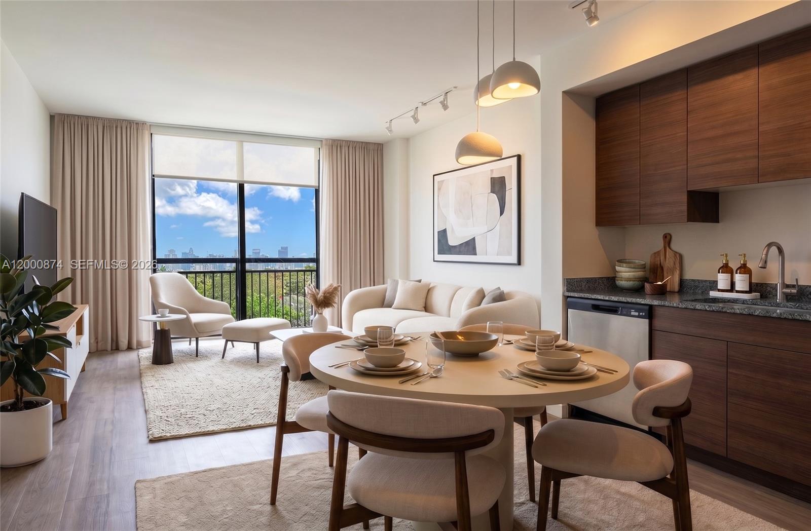 A modern open-concept living and dining area features wood cabinetry, neutral furniture, and balcony views — 315 NW 27th Ave # 319, Miami FL 33125, MIAMI, FL