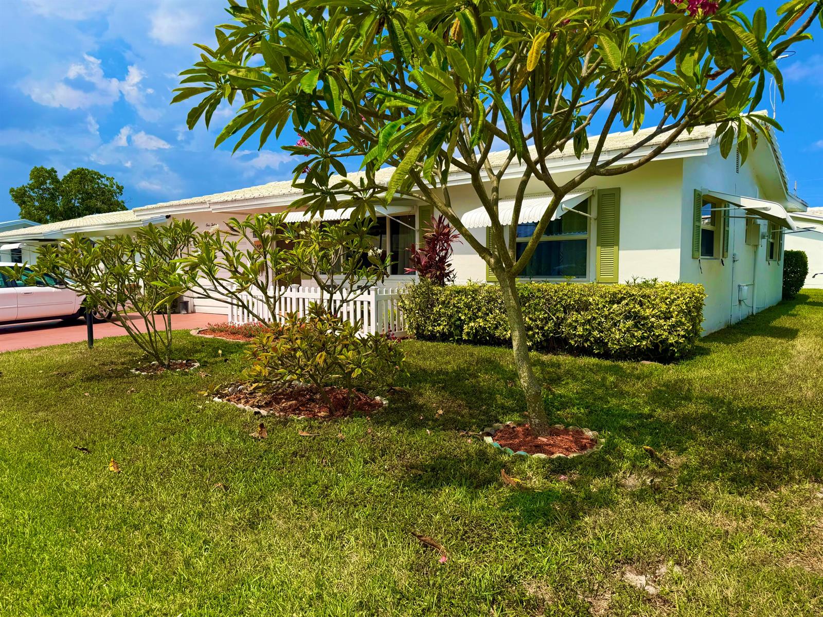 A single-story house with a white exterior, green shutters, and a front yard with trees — 112 SW 9th Street, Boynton Beach FL 33426, BOYNTON BEACH, FL