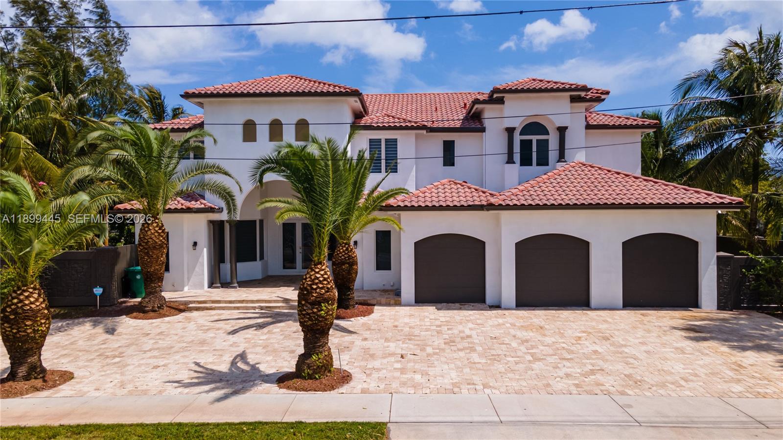 A two-story white house with a red tile roof and a three-car garage — 112 NW 14th Way, Dania Beach FL 33004, DANIA BEACH, FL