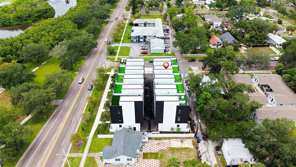 Aerial view of a modern townhouse complex with flat roofs and a central driveway — 2114 4TH STREET S UNIT 7, ST PETERSBURG, FL