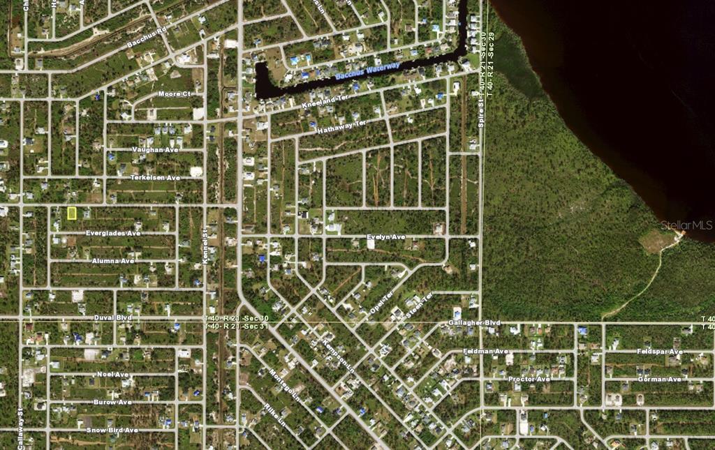 This is an aerial map view of a residential area with a highlighted property lot — 12089 DIVERSEY AVENUE, PORT CHARLOTTE, FL