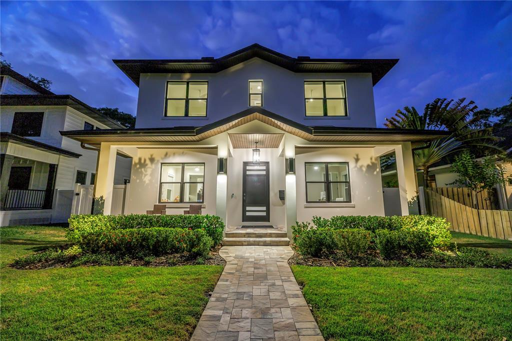 A two-story house with a covered patio, swimming pool, and safety fence in the backyard — 151 17TH AVENUE N, ST PETERSBURG, FL