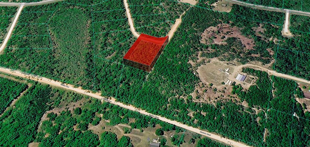 An aerial view shows a rectangular plot of land highlighted in red within a forest — OCALA DRIVE, ALFORD, FL