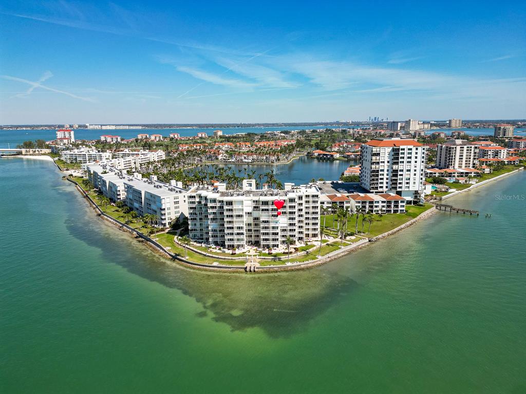 An aerial view shows a large waterfront condominium complex surrounded by a bay — 6105 BAHIA DEL MAR CIRCLE UNIT 682, ST PETERSBURG, FL