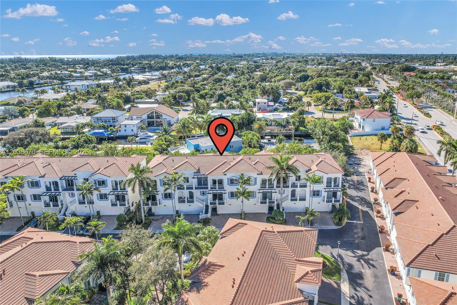 An aerial view shows a row of multi-story townhouses with tile roofs and palm trees — 3127 Waterside Cir, Boynton Beach FL 33435, BOYNTON BEACH, FL