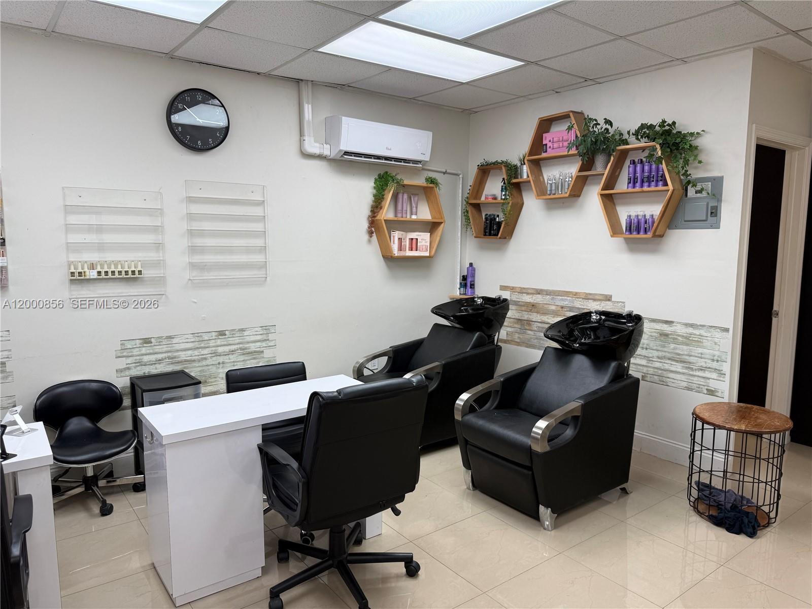 A salon room features two shampoo stations, a manicure desk, and hexagonal wall shelving — 8511 NW South River Dr, Medley FL 33166, MEDLEY, FL