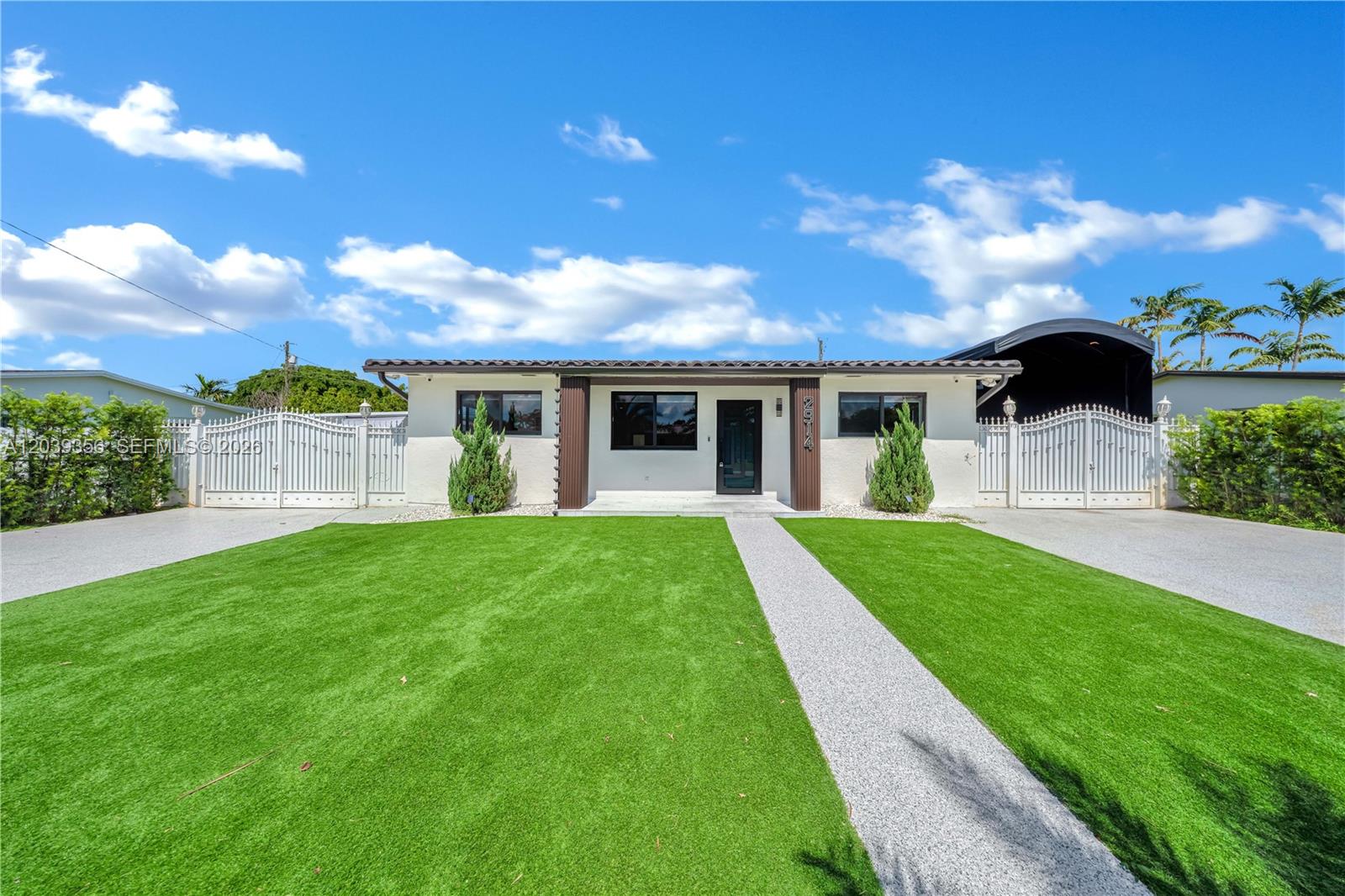 A single-story house with a white exterior, a central entrance, and a green lawn — 2914 SW 103rd Ct, Miami FL 33165, MIAMI, FL