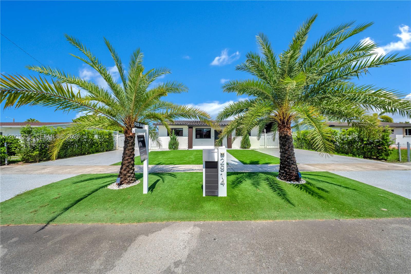 A single-story house features a manicured lawn, two palm trees, and a modern mailbox — 2914 SW 103rd Ct, Miami FL 33165, MIAMI, FL