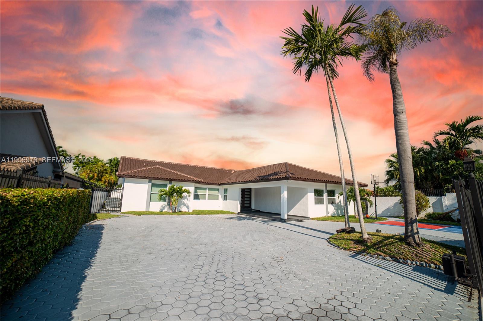 A single-story white house with a tiled roof and a large paved driveway — 3500 SW 111th Ave, Miami FL 33165, MIAMI, FL