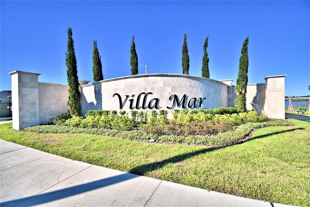 A curved stone monument sign displays the name Villa Mar in front of tall trees — 2335 BRASSIE COURT, WINTER HAVEN, FL