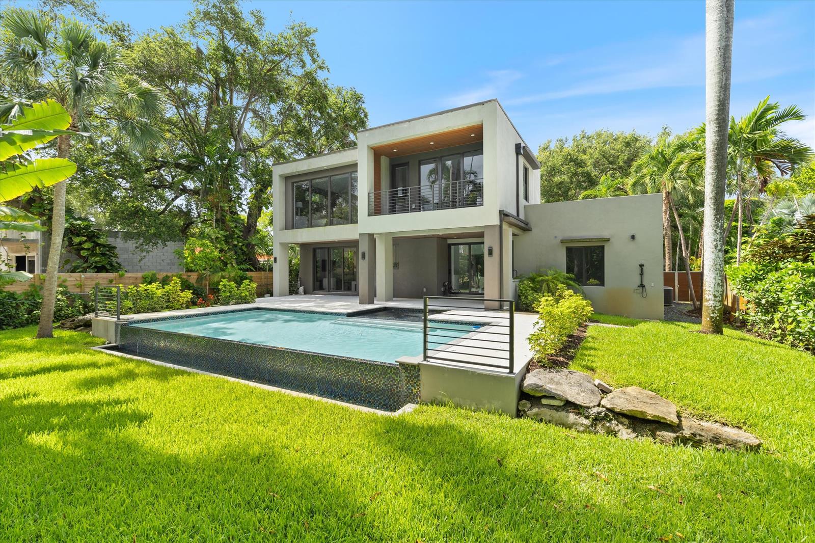 A modern two-story house with a swimming pool and a grassy backyard — 451 NE 119th Street, Biscayne Park FL 33161, BISCAYNE PARK, FL