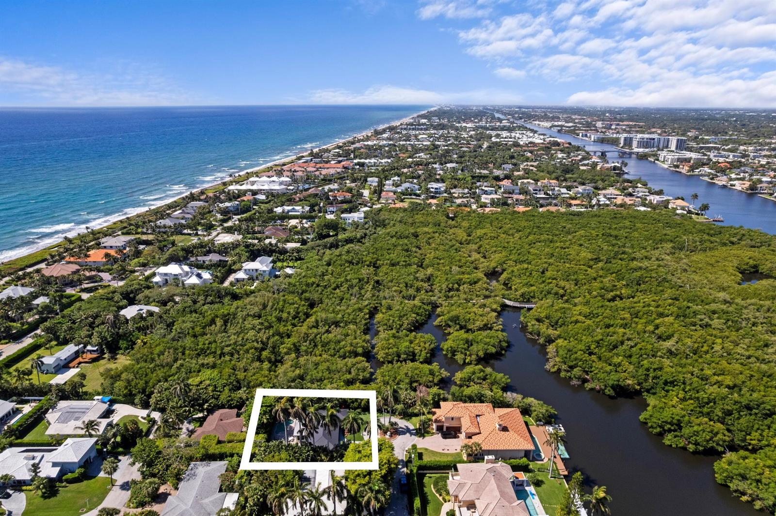 An aerial view shows a coastal neighborhood with a white-outlined house nestled among trees — 35 Anna Street, Boynton Beach FL 33435, BOYNTON BEACH, FL