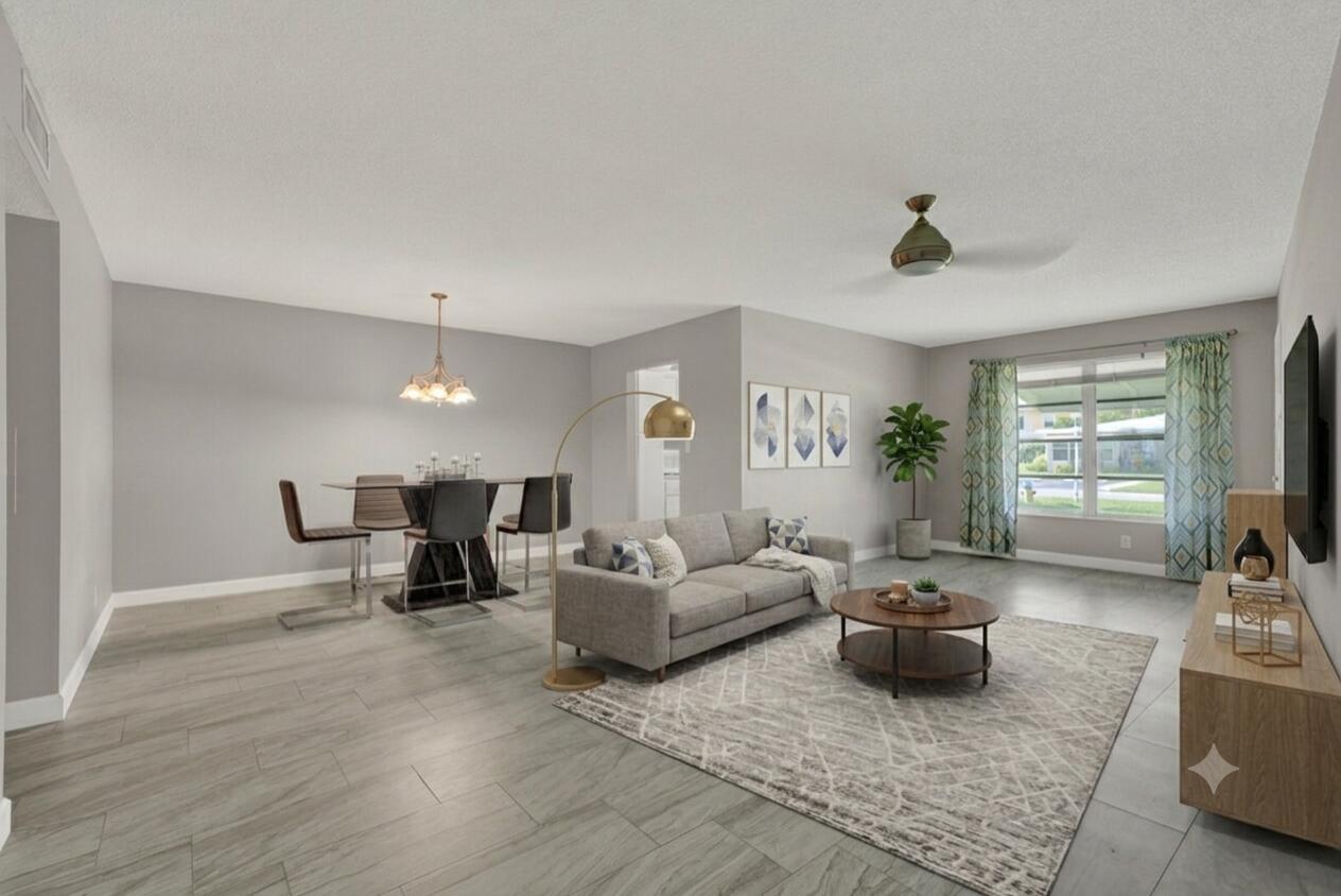 A living and dining area with gray walls, wood-look tile flooring, and modern furniture — 185 High Point Terrace E # B, Delray Beach FL 33445, DELRAY BEACH, FL