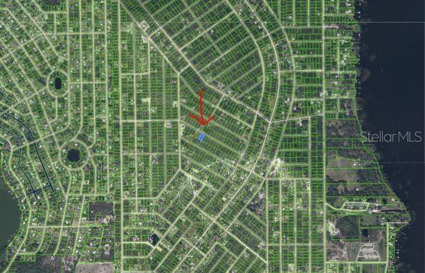 An aerial map view shows a highlighted property lot within a residential neighborhood grid — 1033 CLEVELAND AVENUE, LAKE PLACID, FL
