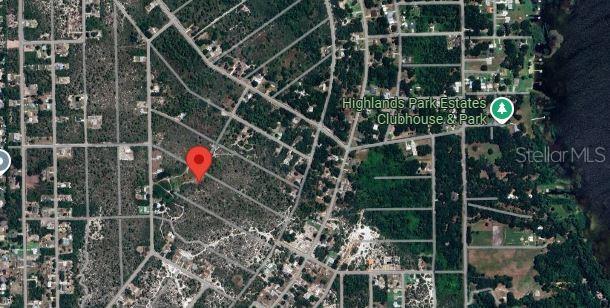 This is an aerial map view showing a red location pin within a residential neighborhood — 1033 CLEVELAND AVENUE, LAKE PLACID, FL