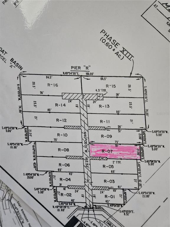 This is a site plan showing the layout and dimensions of boat slips labeled R-01 through R-16 — 2600 HARBOURSIDE DRIVE UNIT R-07, LONGBOAT KEY, FL