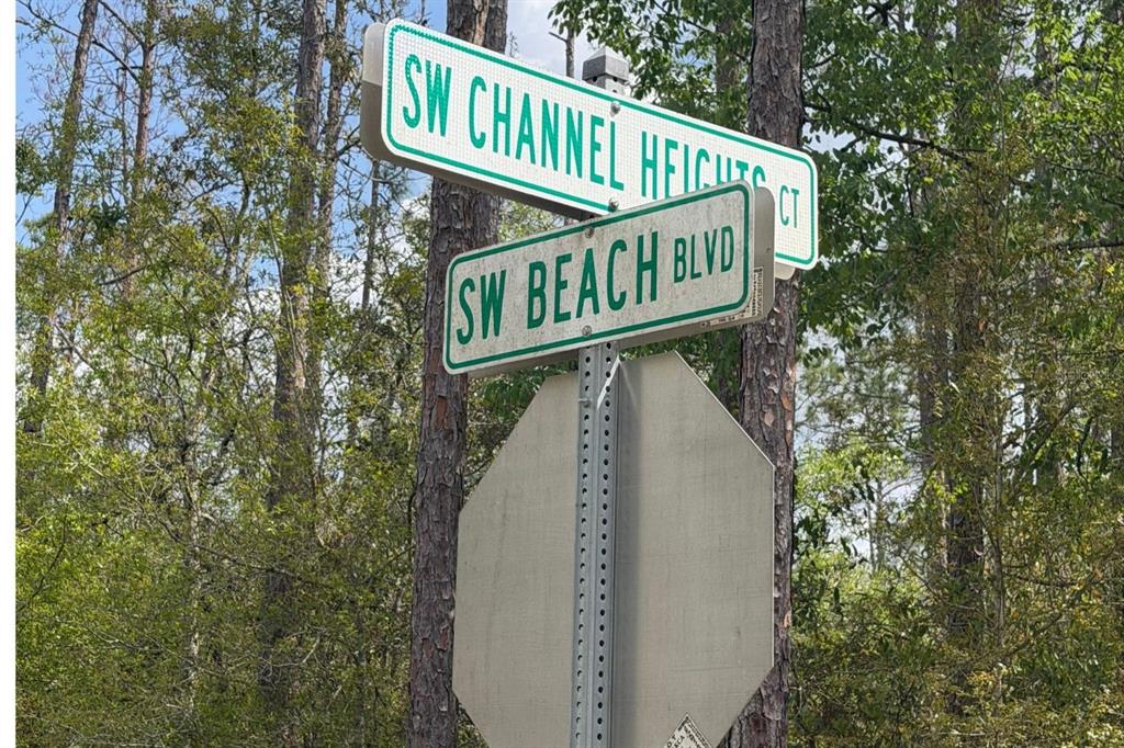 A street sign for SW Channel Heights Ct and SW Beach Blvd stands outdoors — 0 RAINBOW LAKES BOULEVARD, DUNNELLON, FL