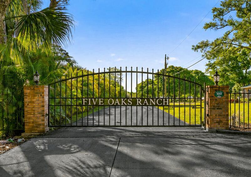 A black metal gate with the name Five Oaks Ranch stands between two brick pillars — 8686 Andrews Avenue, Fort Pierce FL 34945, FORT PIERCE, FL