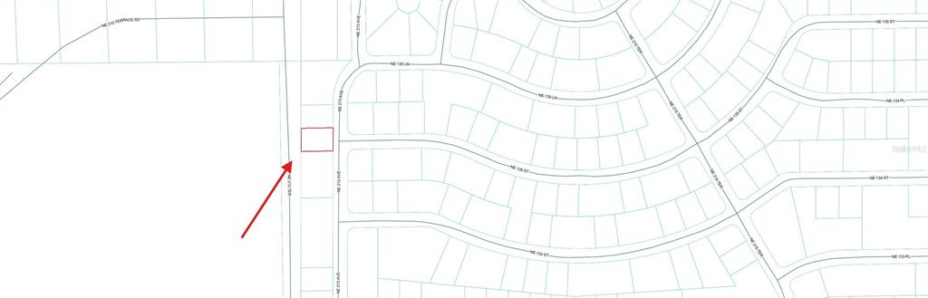 This is a map showing a highlighted rectangular property lot located along a residential street — 0 NE 213 AVENUE, FORT MC COY, FL