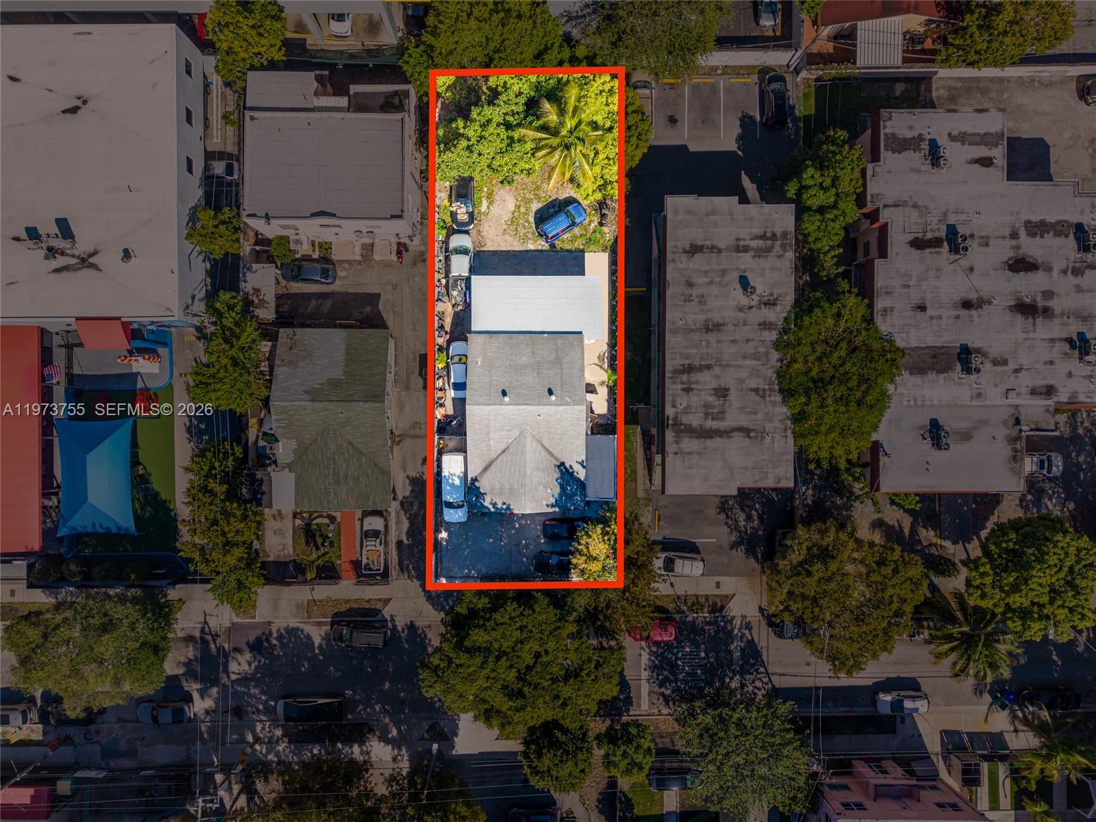 An aerial view shows a rectangular property lot containing a house and parking area — 1143 NW 6th St, Miami FL 33136, MIAMI, FL