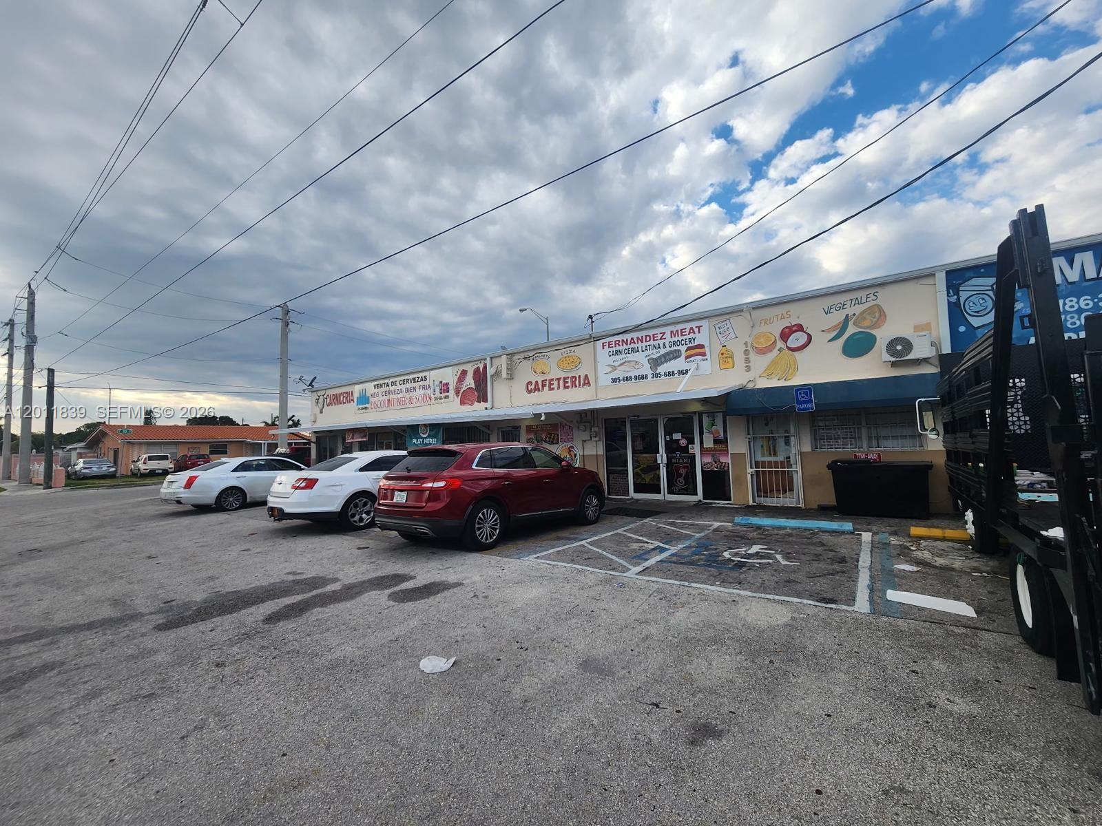 A commercial building with a cafeteria and grocery store features a parking lot out front — 4125 E 10th Ct, Hialeah FL 33013, HIALEAH, FL