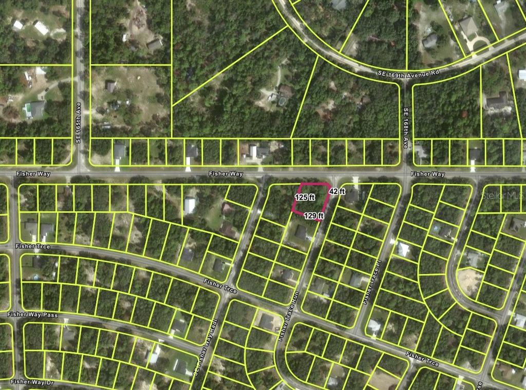 This is an aerial map showing a highlighted vacant residential lot in a suburban neighborhood — TBD FISHER WAY, OCKLAWAHA, FL