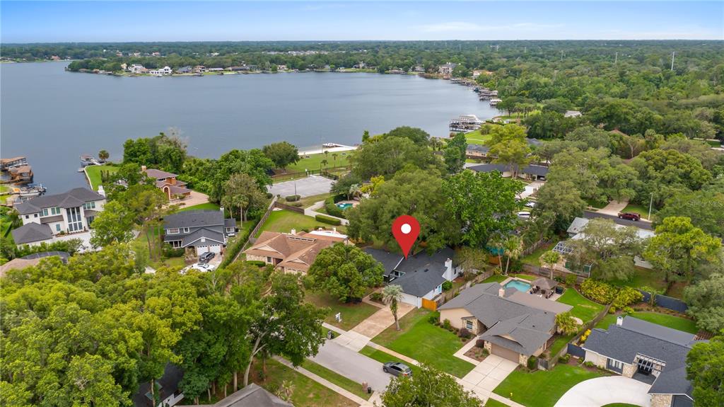 An aerial view shows a residential neighborhood with a house marked by a red pin — 901 CUTLER ROAD, LONGWOOD, FL