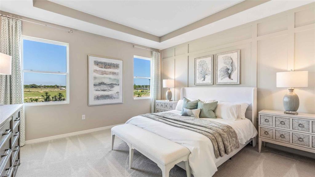 A bedroom features a white bed, paneled accent wall, two nightstands, and two large windows — 3507 HARVEST GARDENS LOOP, PLANT CITY, FL