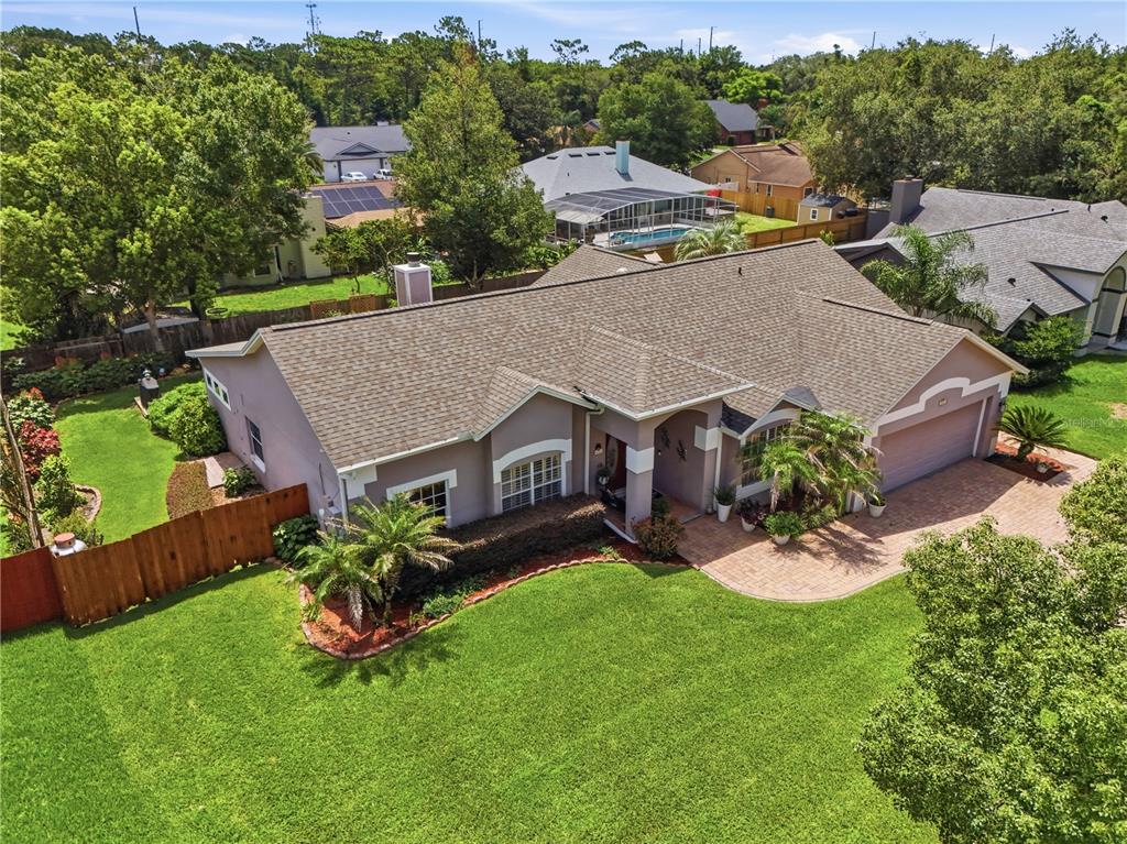 An aerial view of a single-story house with a brown shingled roof and lawn — 803 PINE MEADOWS ROAD, ORLANDO, FL