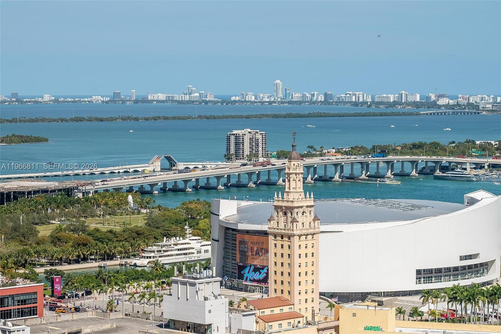 An aerial view shows the Kaseya Center, Freedom Tower, and the MacArthur Causeway in Miami — 225 N Miami Ave # 3307, Miami FL 33128, MIAMI, FL