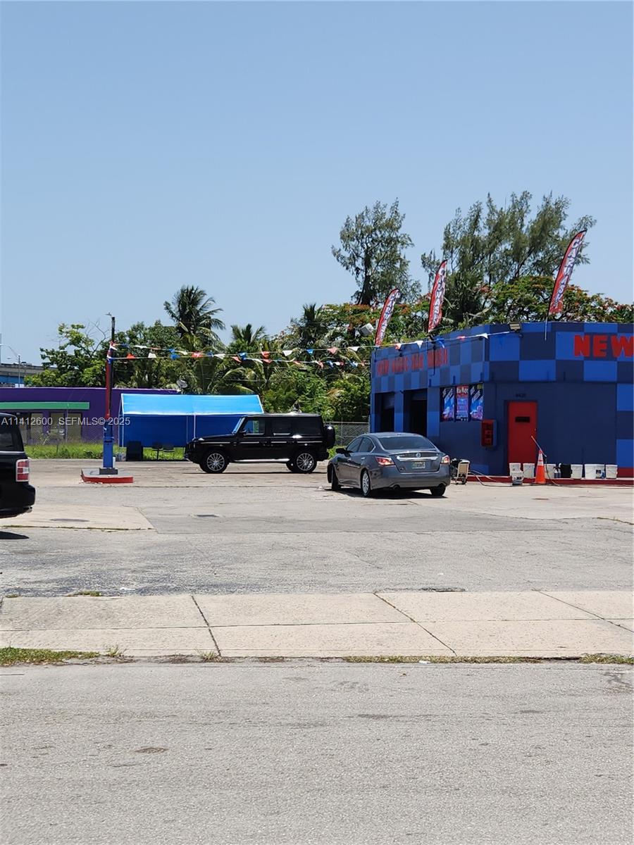 A car wash facility features a blue building, a black SUV, and a gray sedan — 4420 NW 7th Ave, Miami FL 33127, MIAMI, FL