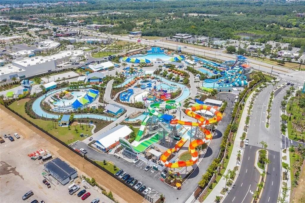 An aerial view of a water park featuring multiple slides, pools, and surrounding parking lots — 2960 SALTED RIM ROAD, KISSIMMEE, FL