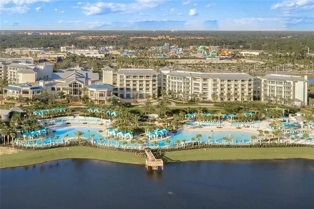 An aerial view of a large resort hotel with a pool complex and a lake — 2960 SALTED RIM ROAD, KISSIMMEE, FL